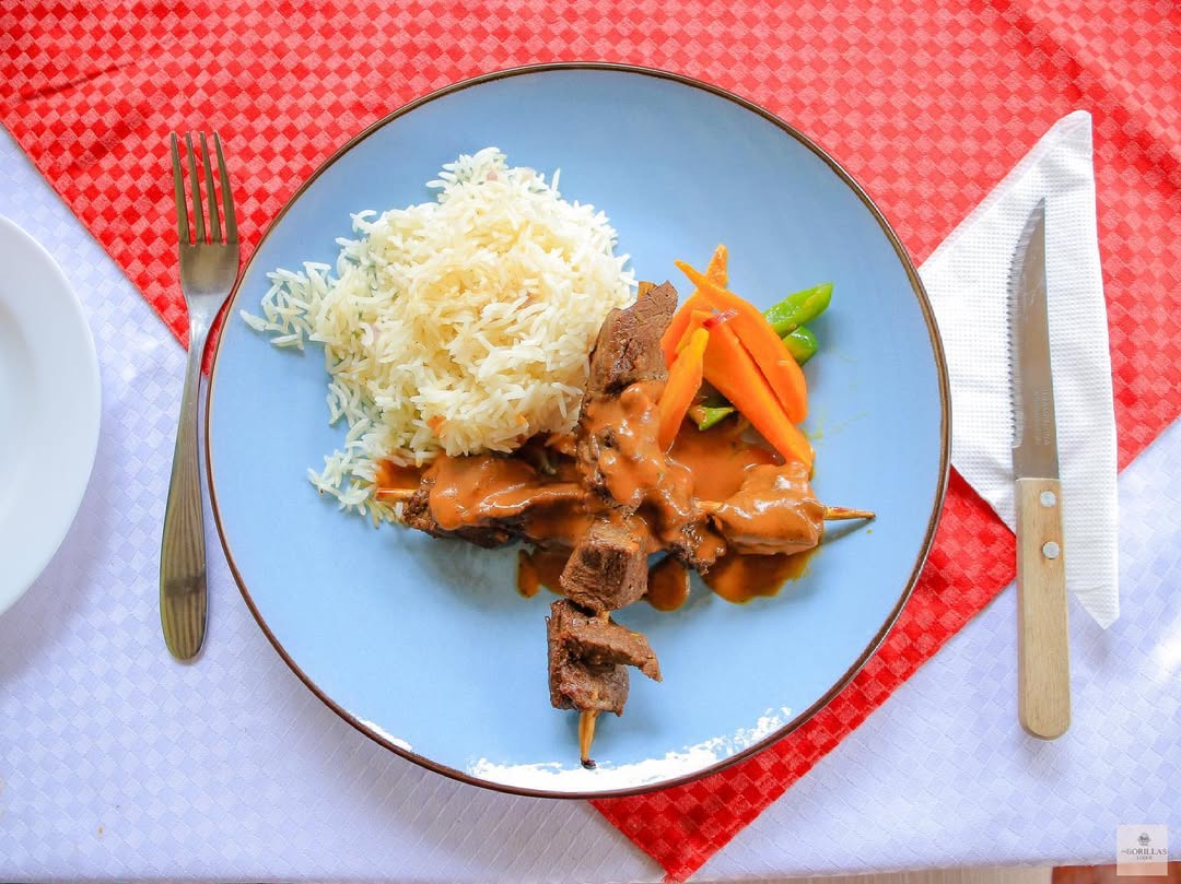 Luxury plated dinner at Four Gorillas Lodge showcasing Uganda’s fresh ingredients