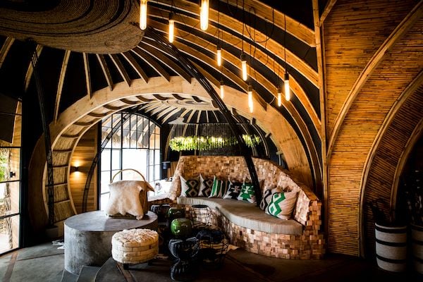 Wilderness Bisate Lodge guest facilities overlooking the Virunga volcanoes in Rwanda