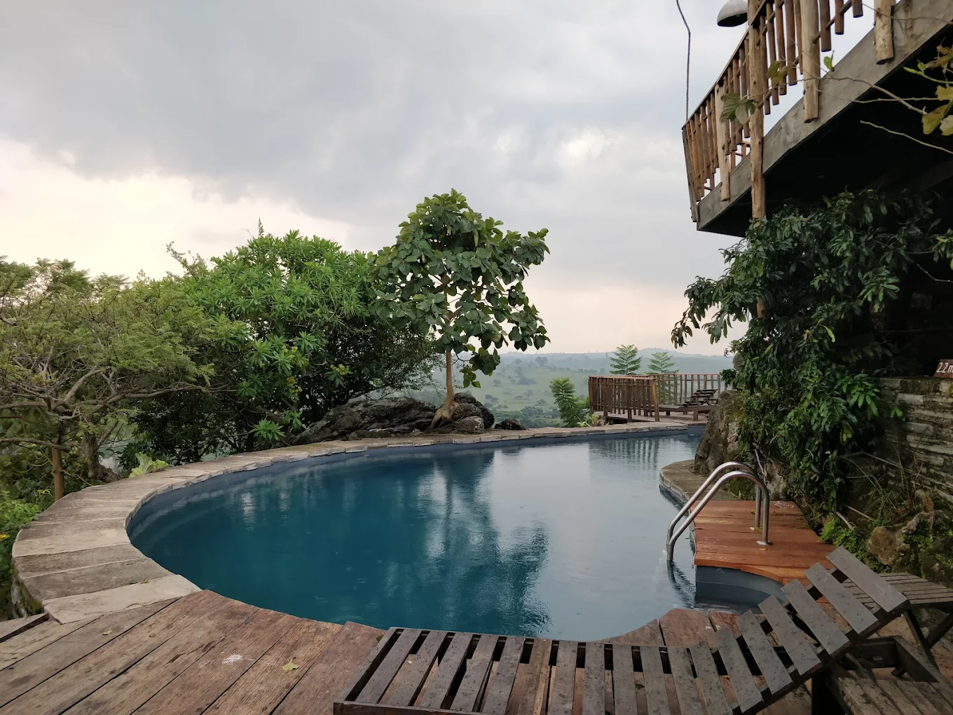 Infinity pool at Kyaninga Lodge with views over Kibale Forest crater lake