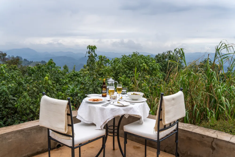 Clouds Mountain Gorilla Lodge is often considered Uganda’s most exclusive gorilla trekking lodge and is ideal for travelers seeking privacy, luxury, and spectacular scenery. Perched high on the Nkuringo Ridge, the lodge offers breathtaking panoramic views of the Virunga Volcanoes, surrounding forests, and rolling hills. Guests enjoy spacious stone cottages, private fireplaces, personalized butler-style service, gourmet dining, and a peaceful