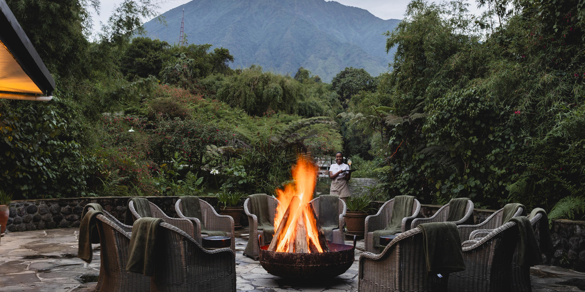 Wilderness Sabyinyo offers an exclusive and intimate luxury safari experience at the foothills of the Virunga Mountains. The lodge features spacious stone cottages, private verandas, elegant furnishings, and exceptional personalized service. Guests enjoy gourmet dining, 
